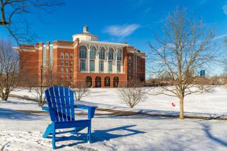 Blue Chair in Snow in front of Library
