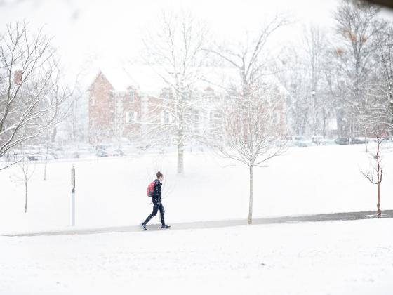 Student walking on a snowy day